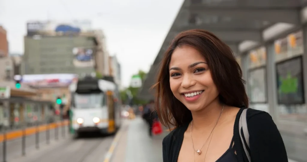Person waiting at a tram station.
